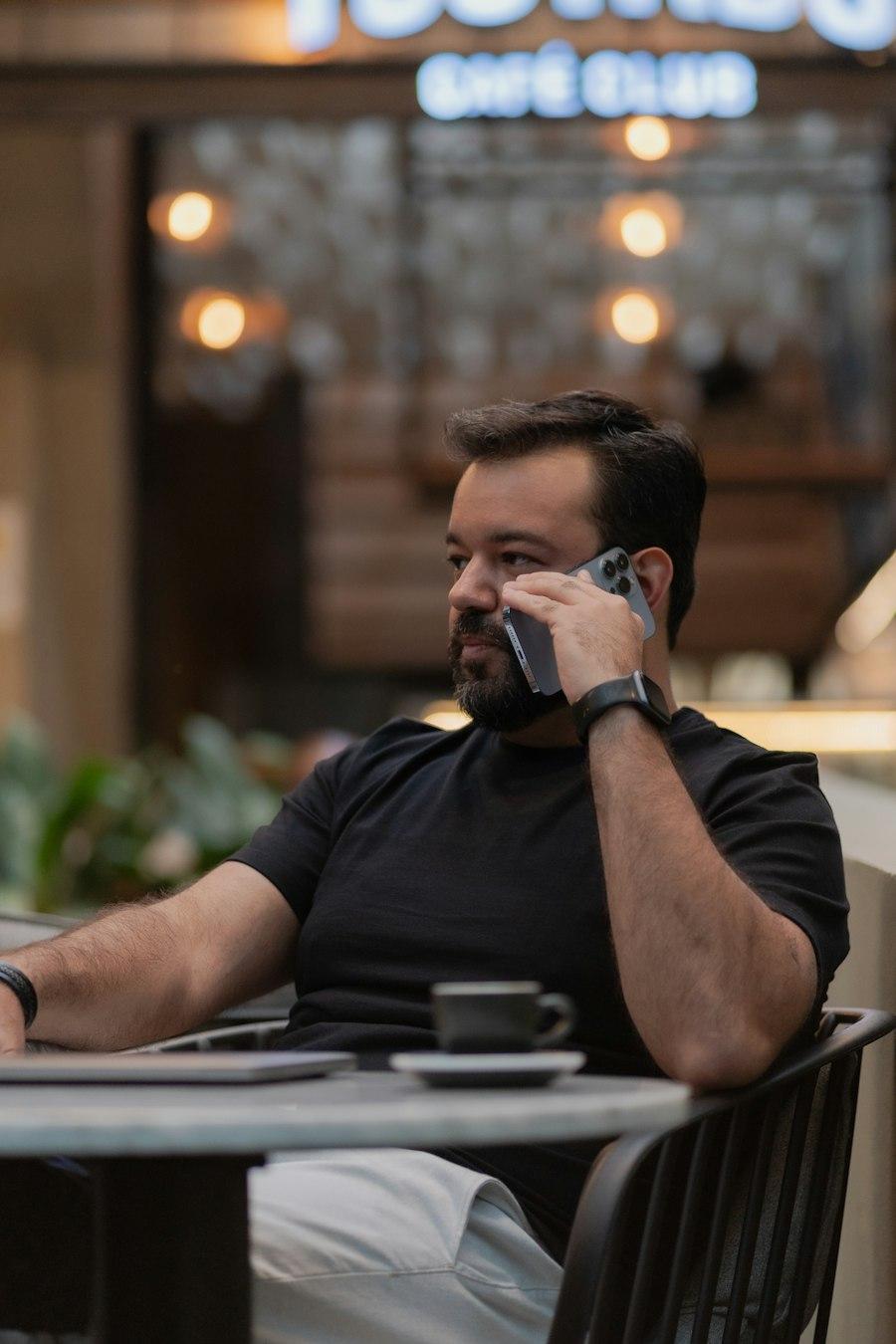 A business owner taking a call at a café table